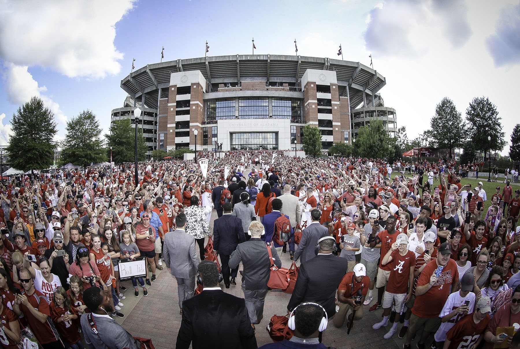 a group of people standing in front of a crowd