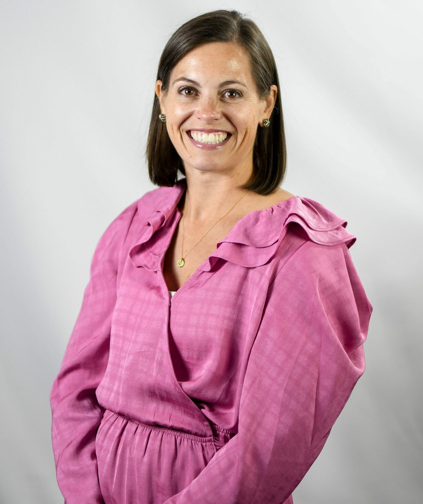 a woman wearing a purple shirt